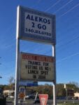 Alekos 2 Go About Us sign